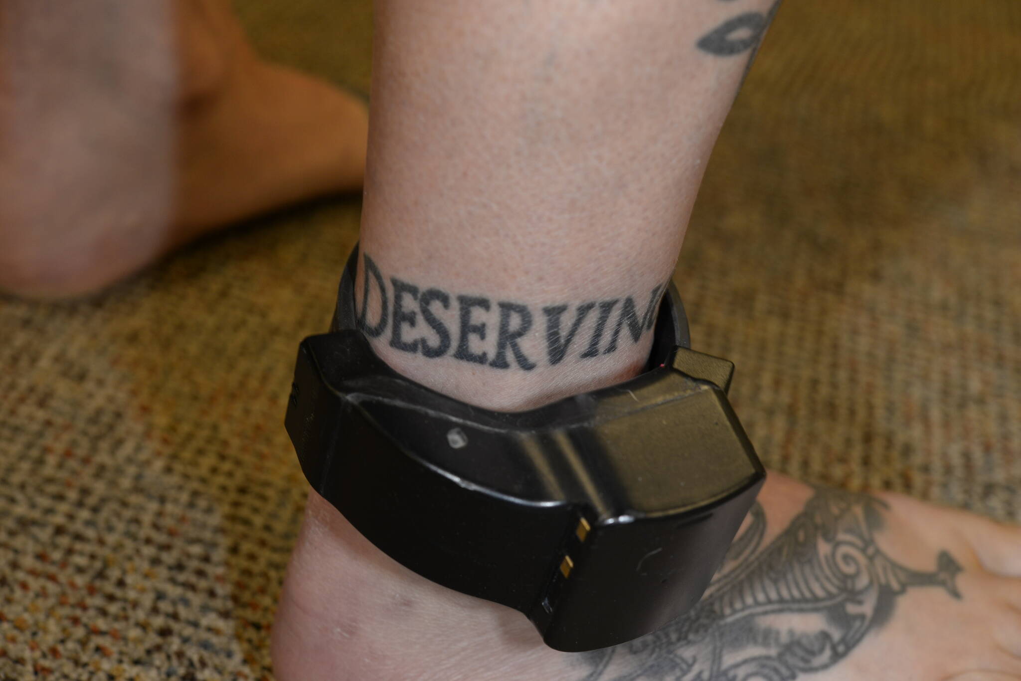 Nelson’s ankle tattoo reads “punish the deserving.” These photos were taken by the FBI after Nelson was charged with murder. Courtesy photo