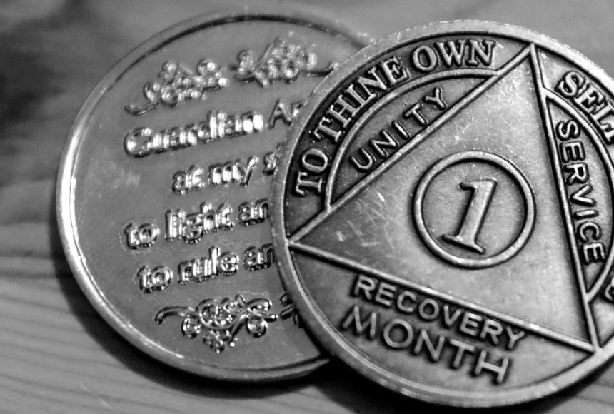 <p>One person’s month recovery coins after battling a fentanyl addiction. (Kevin Clark / The Herald)</p>