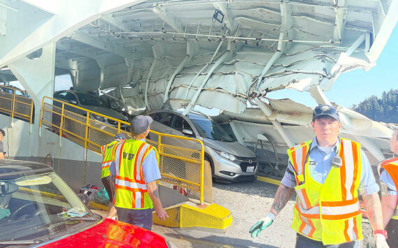 In the immediate aftermath of the crash of the Cathlamet in July 2022, ferry workers and passengers surveyed the serious damage to the boat, which pinned one car in folded steel. (Photo courtesy of Pam Kirkpatrick)