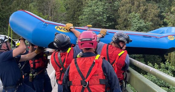 Responders lowered a raft from a 200-foot bridge over the Green River Gorge to help rescue the missing kayakers. Photo courtesy of Puget Sound Fire.