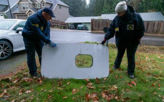 The plane door that flew off of the Alaska Airlines flight 1282 Boeing 737-9 MAX found by NTSB investigators in a Portland residents backyard. (Courtesy of NTSB)