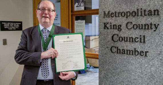 Dwight Dively poses with the proclamation and the MLK Medal of Distinguished Service. Photo courtesy of King County