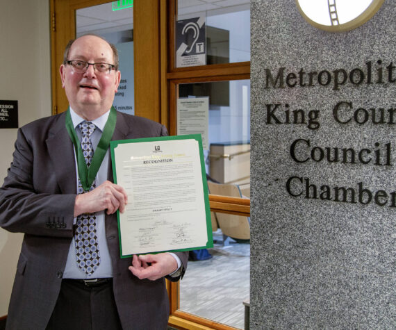 Dwight Dively poses with the proclamation and the MLK Medal of Distinguished Service. Photo courtesy of King County