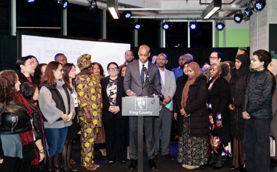 King County Executive Girmay Zahilay, surrounded by community members, announces an executive order to protect immigrants at a press conference Feb. 12, 2026. Photo courtesy of King County Office of the Executive