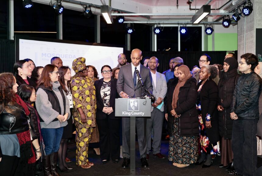 <p>King County Executive Girmay Zahilay, surrounded by community members, announces an executive order to protect immigrants at a press conference Feb. 12, 2026. Photo courtesy of King County Office of the Executive</p>