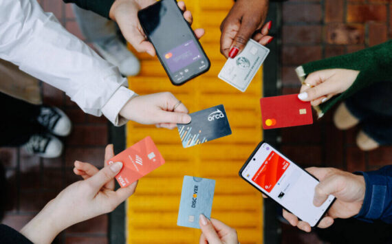 Passengers demonstrate open payments with credit cards and phones to pay transit fares on the ORCA system. COURTESY PHOTO, ORCA