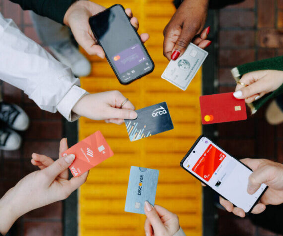Passengers demonstrate open payments with credit cards and phones to pay transit fares on the ORCA system. COURTESY PHOTO, ORCA