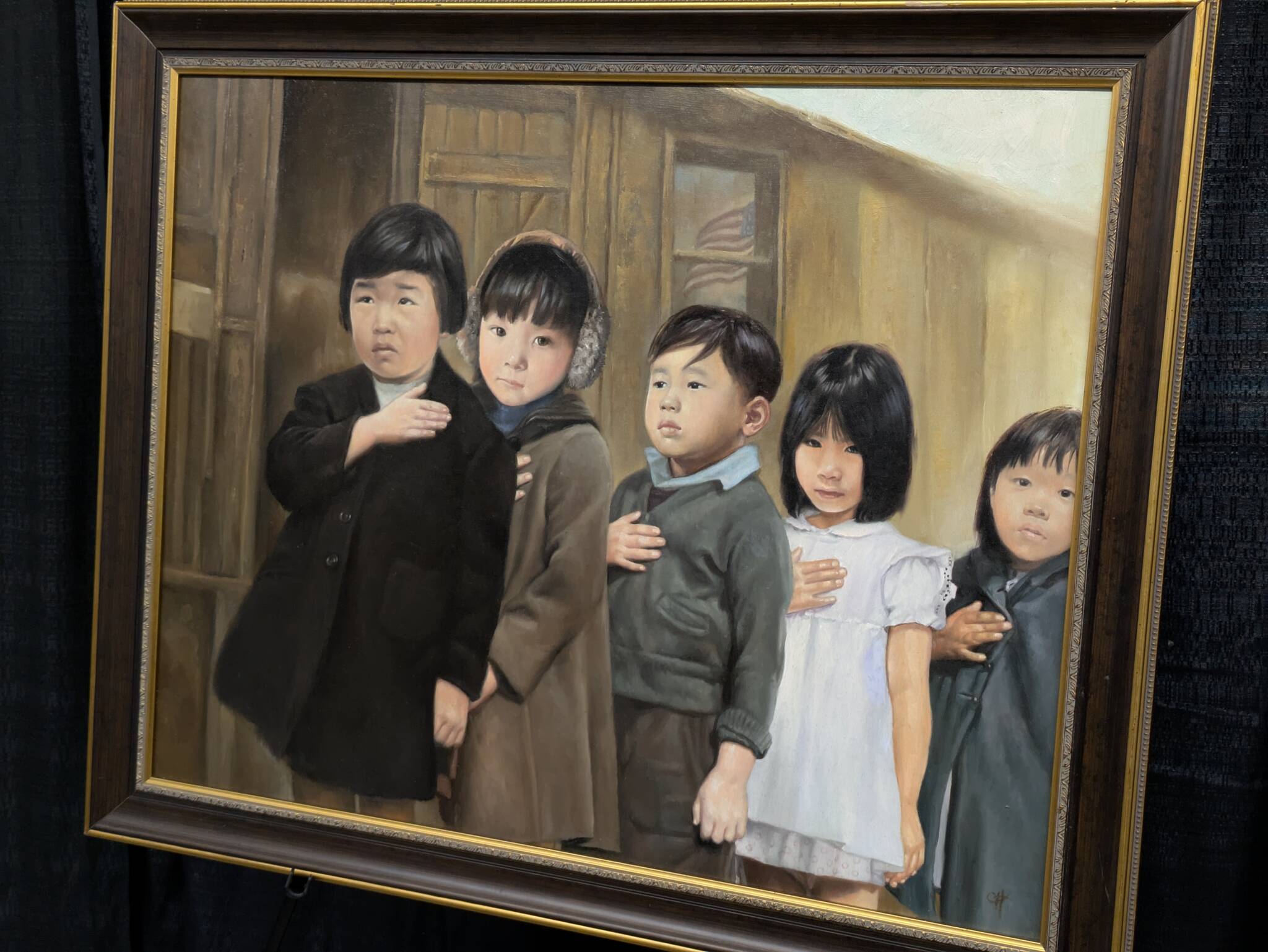 Children were among those imprisoned because of their nationality and ethnicity during WWII in the United States, as shown in this painting by Chris Hopkins. Photo by Bailey Jo Josie/Sound Publishing