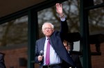 Democratic presidential candidate Senator Bernie Sanders waves to thousands of people waiting outside KeyArena for his rally on March 20, 2016 in Seattle.