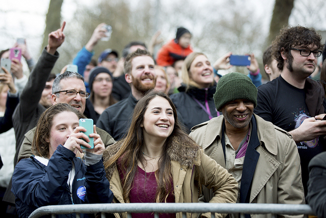 Bernie Sanders supporters welcome the presidential candidate as he speaks to throngs of supporters waiting to enter his rally in Seattle on March 20, 2016.