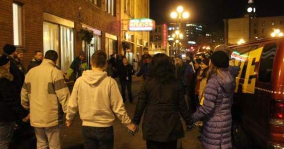 Rescue van volunteers pray outside Union Gospel Mission. Photo by Casey Jaywork. (details)