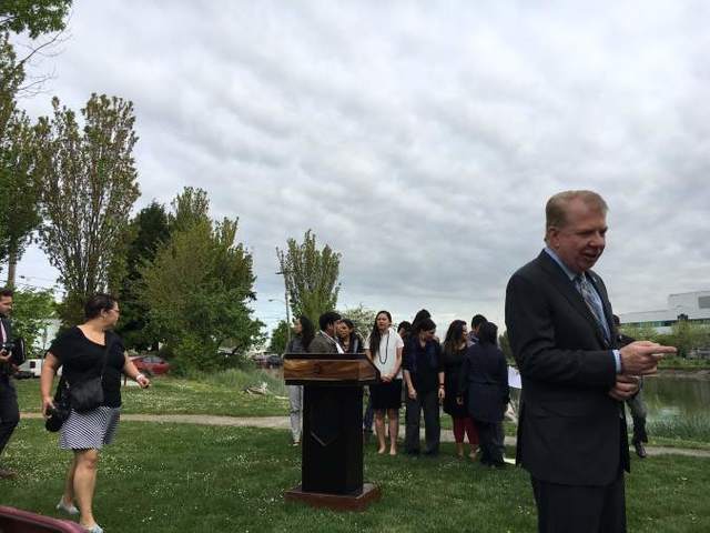 Mayor Ed Murray talks with the media shortly before his remarks along the Duwamish River. Photo by Daniel Person