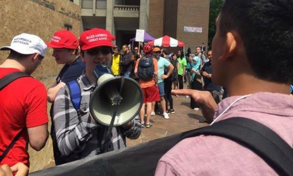 A Trump supporter and a protester engage in &ldquo;civic dialogue&rdquo; at a UW rally earlier this month. Photo courtesy of Chevy Swanson