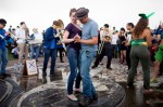 A couple dances as a brass group plays at Gasworks Park after the parade.