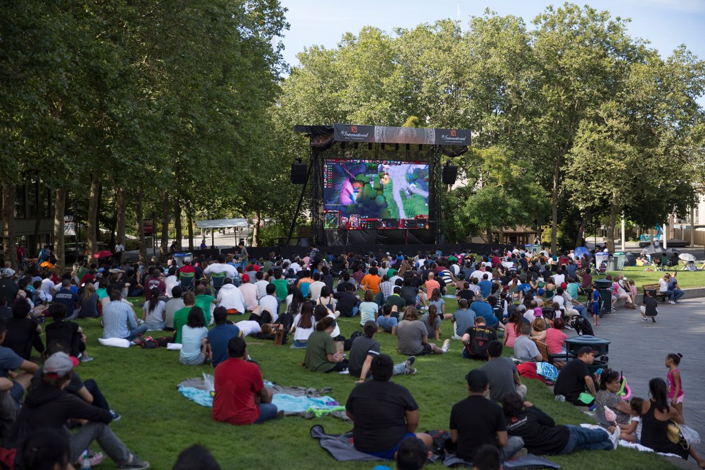 Hundreds of fans find the shade at Seattle Center to watch the final match.
