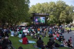 Hundreds of fans find the shade at Seattle Center to watch the final match.