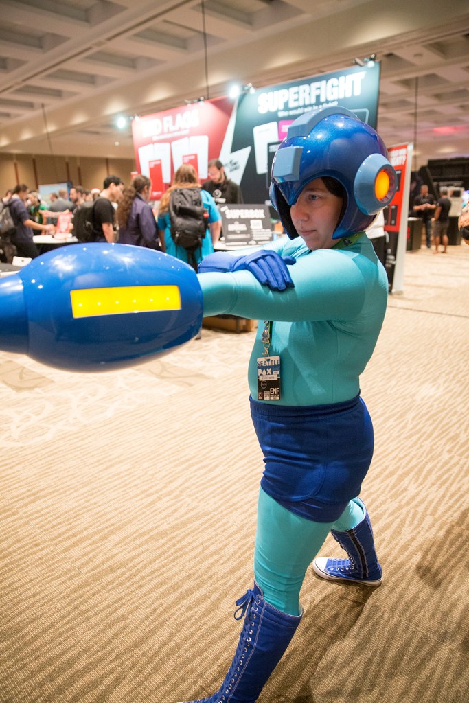 Lily Martinez from Burien wears their Mega Man costume in the exhibit hall. Lily has been attending PAX since 2008.