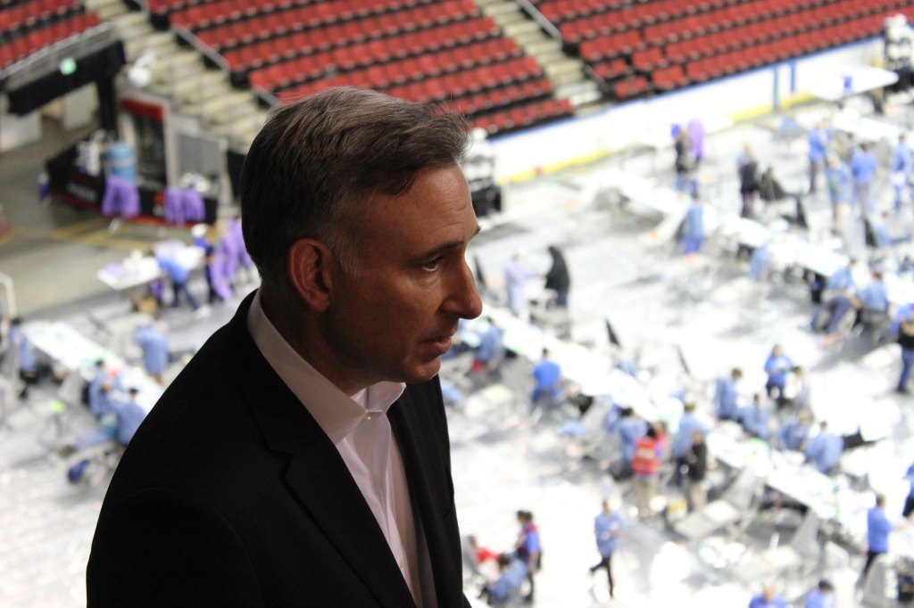 King County Executive Dow Constantine standing in front of the basketball court clinic. Photo by Casey Jaywork.