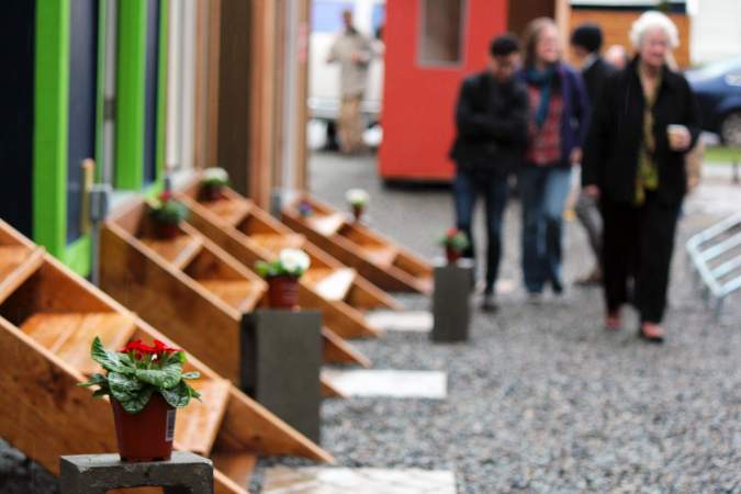 Neighbors welcomed new residents to a tiny house encampment in the Central District with flowers. Photo by Sara Bernard.