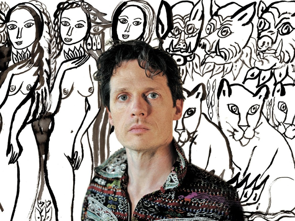 Arrington de Dionyso and one of his works, &lsquo;Trance Dancers.&rsquo; Photo of artist by Lucinda Roanoke