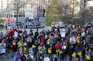 Activists rally outside City Hall on February 1, urging the city to close its Wells Fargo accounts. Photo by Sara Bernard.