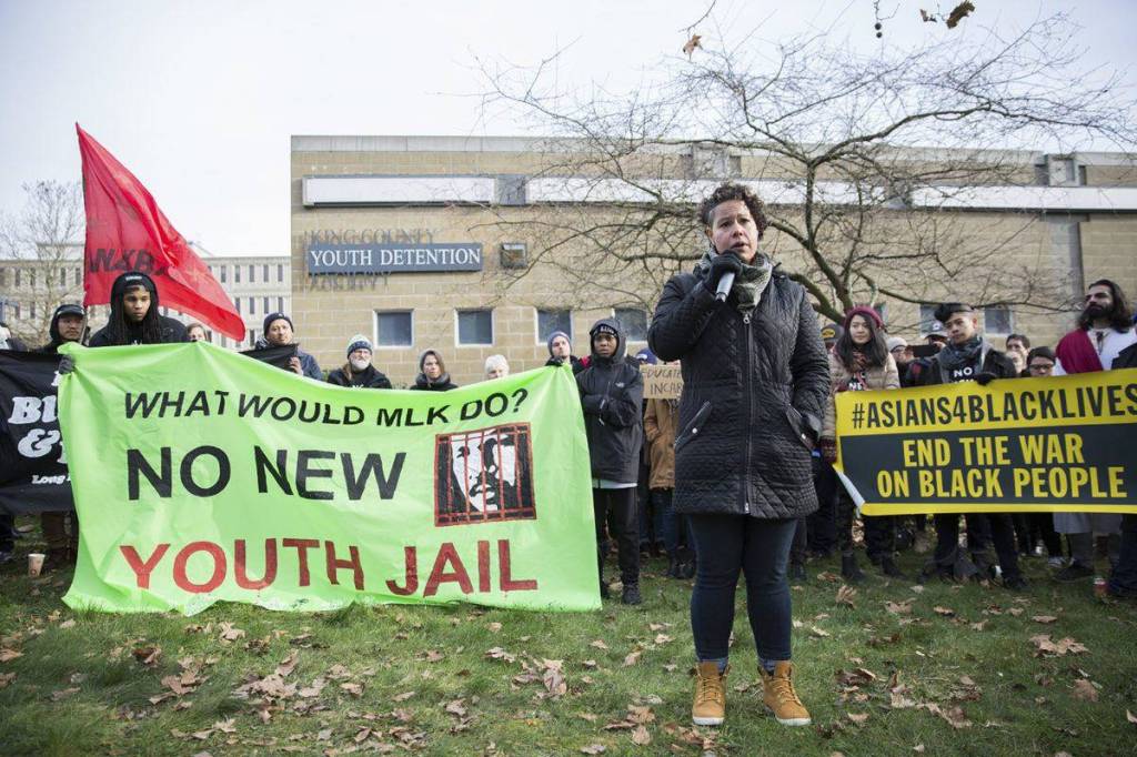 Activist Nikkita Oliver speaks at a demonstration in front of the current King County Youth Detention Facility. Photo by Alex Garland