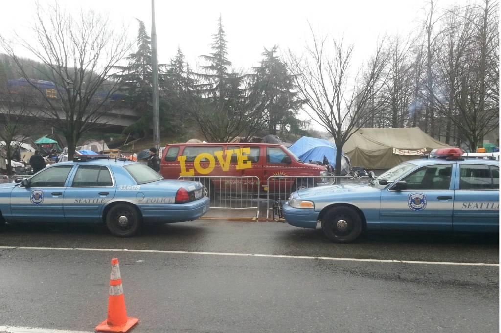 Police and Union Gospel Mission assist in the forced eviction of homeless campers at the Field on March 7, 2017. Photo by Casey Jaywork.