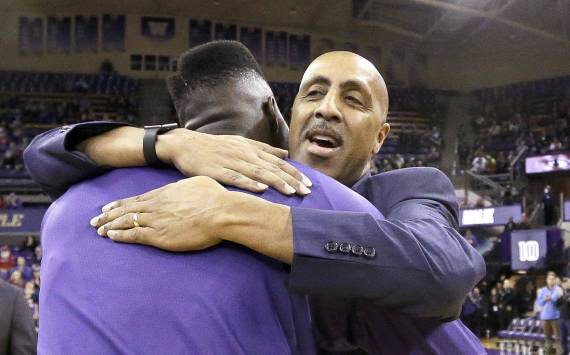 Lorenzo Romar embraces Malik Dime on senior night before one of his final games as coach of the Washington Huskies. AP Photo/Elaine Thompson