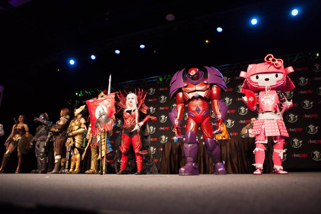 Contestants line up on stage for the first round of voting.