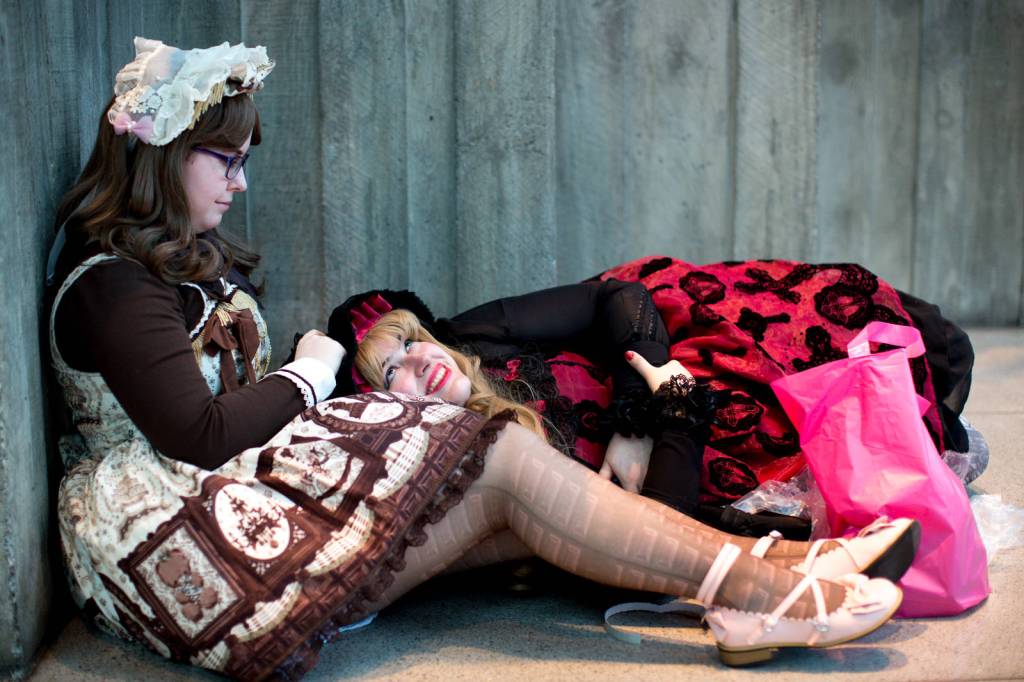 Anna, left, and Melissa, right, take a break between panels and cosplay to catch some rest.