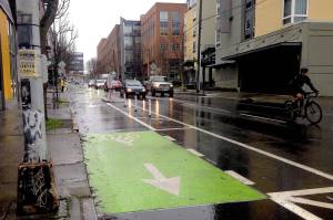 A bicyclist observes the Roosevelt bike lane. Photo by Jesus Hidalgo