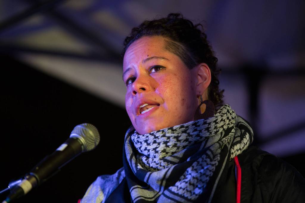 Mayoral candidate, poet and educator Nikkita Oliver addresses the crowd.
