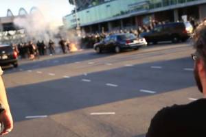 A screenshot of video shows the fire, which police quickly extinguished, from a distance. Screenshot via Kiely Allen.