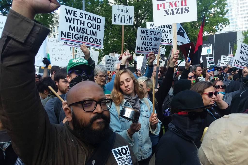 Seattleites counter-protest outside City Hall against an &lsquo;anti-sharia,&rsquo; pro-Trump rally. Photo by Casey Jaywork