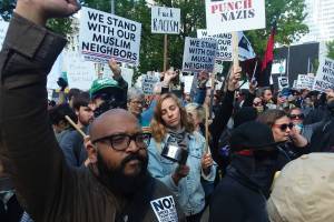 Seattleites counter-protest outside City Hall against an &lsquo;anti-sharia,&rsquo; pro-Trump rally. Photo by Casey Jaywork