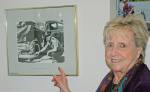 Schmitz points out her father in a photo displayed at the Kent Police station. Photo by Steve Hunter