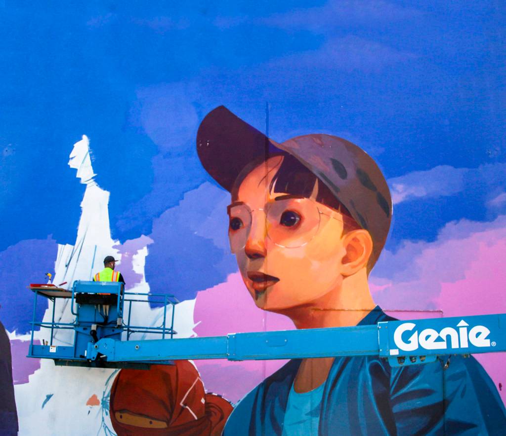 Andrew Hem works on his mural for The SODO Track. Photo by @wiseknave.