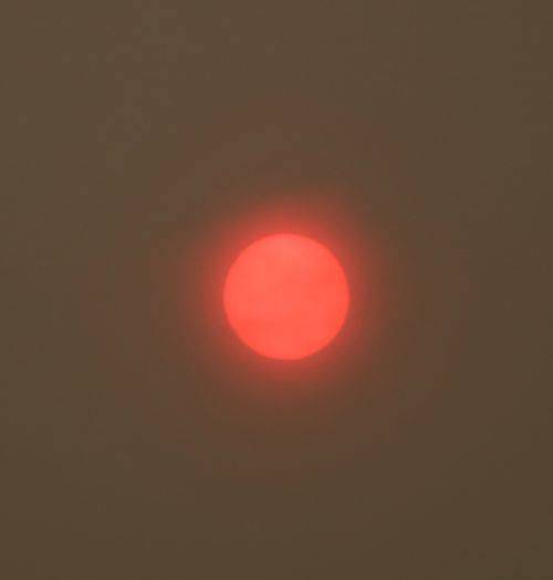 A hazy red sun this morning was caused by wildfires. Andy Nystrom/ Redmond Reporter