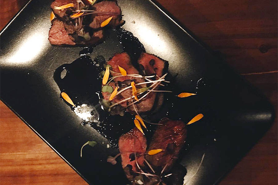 Bison strip loin with charred onion jus. Courtesy of Carnivore