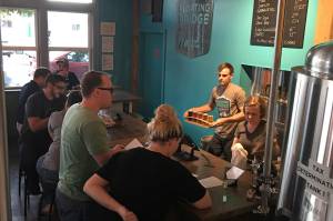 Dawn Perry and Russ Cornell work the tap room at Floating Bridge. Courtesy of Floating Bridge Brewing