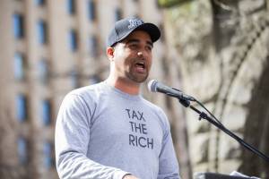 Jesse Hagopian sports a &ldquo;tax the rich&rdquo; t-shirt. Seattle is trying to do just that. Photo by Alex Garland.
