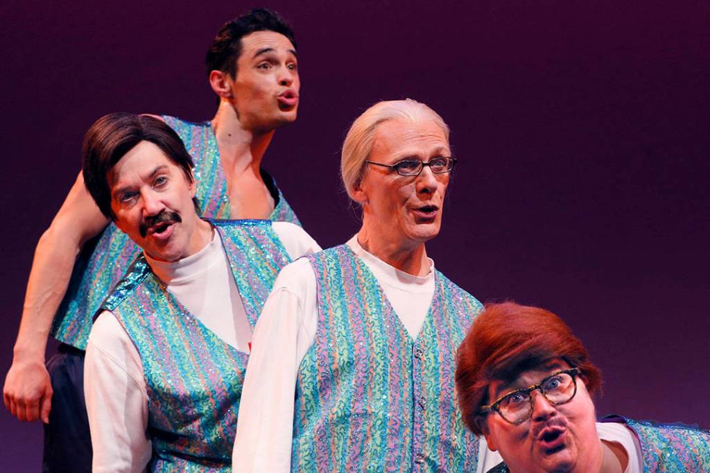 Peggy Platt (front) and Lisa Koch (second from rear) bring their platter of holiday treats back to ACT, Nov. 30–Dec. 17. Photo by Chris Bennion