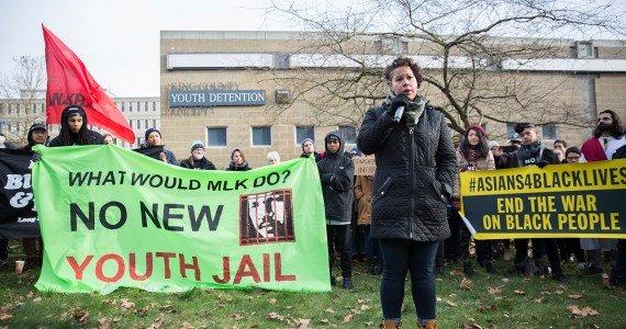 Nikkita Oliver speaks at a demonstration in front of the current King County Youth Detention Facility in January. Photo by Alex Garland
