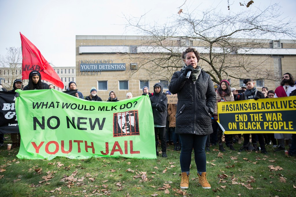 Nikkita Oliver speaks at a demonstration in front of the current King County Youth Detention Facility in January. Photo by Alex Garland