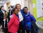 Mayor Jenny Durkan (center) embraces Menbe Tadesse (left) after her official swear-in at Rainier Beachs Ethiopian community center Tuesday. Photo by Melissa Hellmann