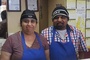 Jagajit Singh Samra and his wife Parwinder in their West Seattle business, A Pizza Mart. Courtesy of Keep Seattle Livable for All