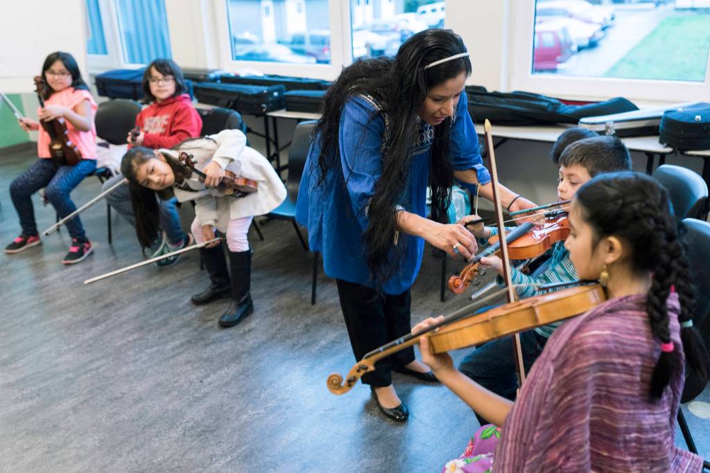 Paula Madrigal and Young String Project Outreach students. Photo by Ted Zee