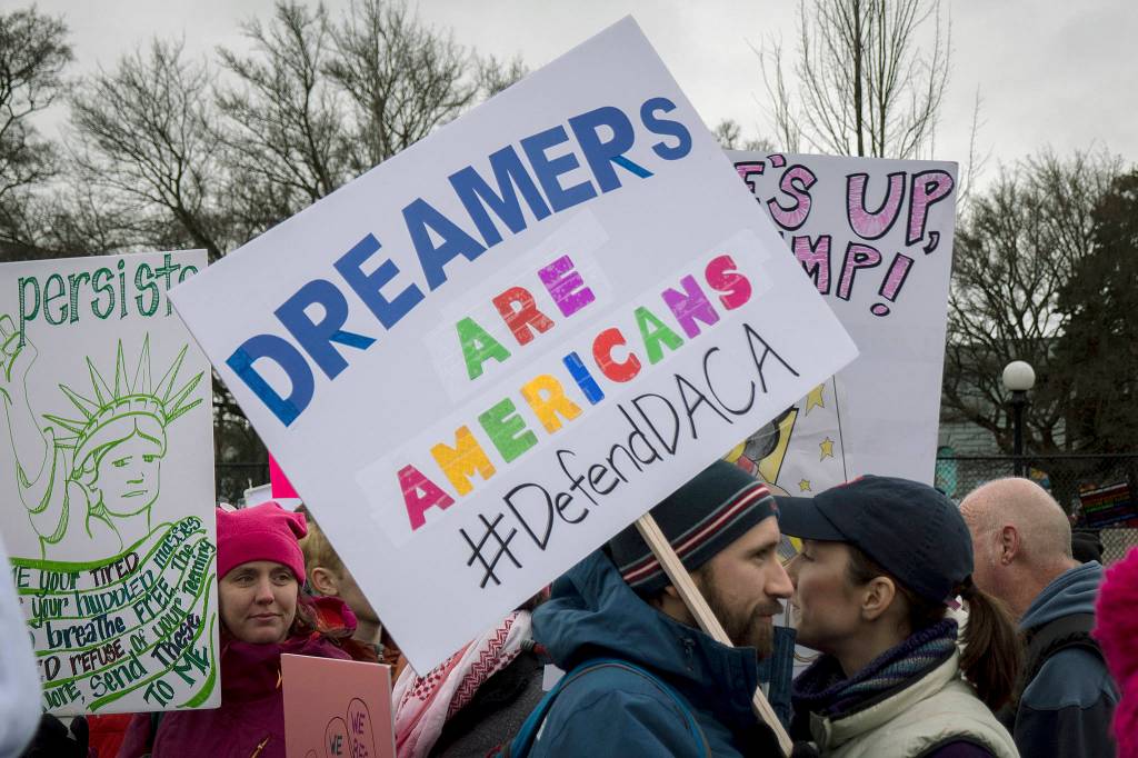 A pro-immigrant sign at the                                 2018 Womens March in Seattle. 
Photo by David Lee/Flickr