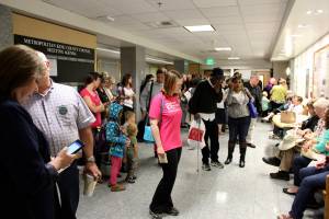 Attendees wait outside the King County Council Chambers last July. The council ruled that CPCs had to post signs stating that they are not health care facilities. Photo by Sara Bernard