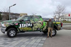 David Swaintek stands in front of his junk removal truck. Photo courtesy of Hanna Swaintek/JDog Junk Removal Lake Union